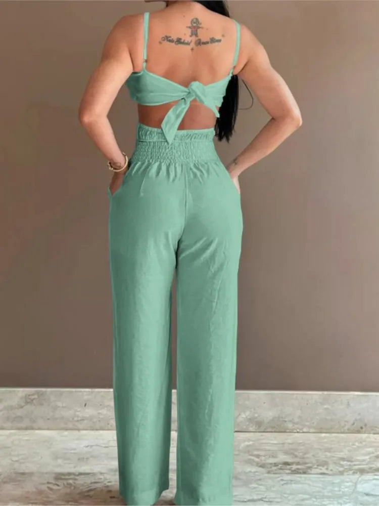 Summer Spaghetti Strap Fashion Jumpsuit New Women Floral Pattern Shirred Hollow Out Casual Asymmetricsal Neck Backless Jumpsuits